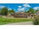 Stone community entrance sign that reads 'Greenfield Lakes', complemented by trees and manicured landscaping at 2503 E Camellia Dr, Gilbert, AZ 85296