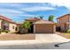 Charming single-story home featuring a tile roof, desert landscaping, and a two-car garage at 2503 E Camellia Dr, Gilbert, AZ 85296