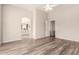 Bright and airy main bedroom with wood floors, ceiling fan, and archway to bathroom and walk-in closet at 2503 E Camellia Dr, Gilbert, AZ 85296