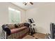 Cozy bedroom with neutral walls, a daybed, and a large window for natural light at 2734 W Bowker St, Phoenix, AZ 85041