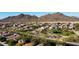 Expansive aerial view of a desert neighborhood with mountain views at 29966 N 72Nd Dr, Peoria, AZ 85383