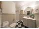 Classic bathroom design with checkered floor, vanity, and step-in shower at 29966 N 72Nd Dr, Peoria, AZ 85383