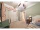 Comfortable bedroom with carpeted floors, a ceiling fan, and standard closet doors at 29966 N 72Nd Dr, Peoria, AZ 85383