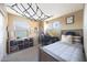 Comfortable bedroom featuring bed, large window, and shelving at 29966 N 72Nd Dr, Peoria, AZ 85383