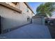 View of the home's exterior showing additional garage space and a well-maintained side yard at 29966 N 72Nd Dr, Peoria, AZ 85383