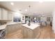 Open floor plan with eat-in kitchen, quartz counters and adjacent living space at 29966 N 72Nd Dr, Peoria, AZ 85383