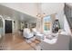 Bright and airy living room featuring high ceilings, hardwood floors, and comfortable seating at 29966 N 72Nd Dr, Peoria, AZ 85383