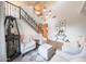 Elegant living room area with a staircase, hardwood floors, and an open floor plan at 29966 N 72Nd Dr, Peoria, AZ 85383