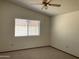 Bright and cozy bedroom with carpeted floor and a ceiling fan at 314 E Campo Bello Dr, Phoenix, AZ 85022