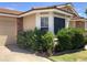 Single-story home with green bushes next to the driveway at 314 E Campo Bello Dr, Phoenix, AZ 85022