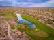 Picturesque view of a Primary-planned golf course community with verdant green fairways and tranquil lake at 31900 N 127Th Ln, Peoria, AZ 85383