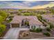 Beautiful aerial view of the home showcasing its architecture and low-maintenance desert landscaping at 31900 N 127Th Ln, Peoria, AZ 85383