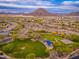 Gathering-friendly neighborhood park with playgrounds, and basketball court amid homes with desert landscaping at 31900 N 127Th Ln, Peoria, AZ 85383