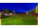 Large lush backyard showcasing green lawn, desert landscaping, pool and spa at 31900 N 127Th Ln, Peoria, AZ 85383