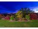Lovely backyard showcasing plants, flowers and desert landscaping at 31900 N 127Th Ln, Peoria, AZ 85383
