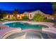 Sparkling pool and lush backyard showcasing desert landscaping and beautiful plants at 31900 N 127Th Ln, Peoria, AZ 85383