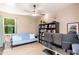 Cozy bedroom with a ceiling fan, neutral decor, and ample natural light, creating a comfortable and inviting space at 31900 N 127Th Ln, Peoria, AZ 85383