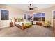 A serene bedroom featuring natural light, neutral tones, and a comfortable layout at 31900 N 127Th Ln, Peoria, AZ 85383