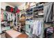 Walk-in closet with ample shelving and storage for clothes and accessories at 31900 N 127Th Ln, Peoria, AZ 85383