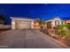 Stunning home featuring large garage, driveway and desert landscaping at 31900 N 127Th Ln, Peoria, AZ 85383