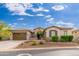 Beautiful single-story home with desert landscaping, a three-car garage, and a well-maintained exterior at 31900 N 127Th Ln, Peoria, AZ 85383