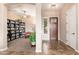 Open foyer with tile flooring, a decorative front door, and views into the adjacent living spaces at 31900 N 127Th Ln, Peoria, AZ 85383