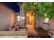 Inviting front porch with stone accent, seating and a view of the front yard at 31900 N 127Th Ln, Peoria, AZ 85383