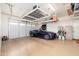Spacious garage with epoxy floors, storage racks, and a well-organized tool area at 31900 N 127Th Ln, Peoria, AZ 85383