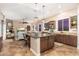 A gourmet kitchen boasts granite countertops, a center island, and a seamless transition into a cozy living space at 31900 N 127Th Ln, Peoria, AZ 85383