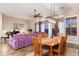 Spacious living area with dining table, sofa, ceiling fan and piano provides a welcoming atmosphere at 31900 N 127Th Ln, Peoria, AZ 85383