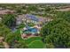 An aerial view of the property showcasing a large pool and solar panels at 3410 E Inglewood Cir, Mesa, AZ 85213
