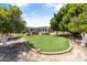 Expansive backyard with a well-manicured lawn, mature trees, and a view of the pool area at 3410 E Inglewood Cir, Mesa, AZ 85213