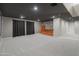 Finished basement featuring a bar area, recessed lighting and new carpet at 3410 E Inglewood Cir, Mesa, AZ 85213