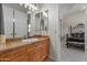 Bathroom featuring a vanity with a ceramic countertop and traditional accents at 3410 E Inglewood Cir, Mesa, AZ 85213