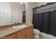 Bathroom featuring a vanity with storage, granite countertops, and a shower with black curtain at 3410 E Inglewood Cir, Mesa, AZ 85213