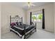 Bedroom showcasing a metal frame bed, soft carpet, and a window at 3410 E Inglewood Cir, Mesa, AZ 85213