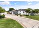 Charming home featuring a three-car garage, solar panels and manicured landscaping at 3410 E Inglewood Cir, Mesa, AZ 85213