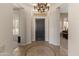 Inviting foyer with tile flooring, decorative mosaic, and views into adjacent living spaces at 3410 E Inglewood Cir, Mesa, AZ 85213