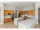 Modern kitchen with stainless steel appliances, double island, and tile floors at 3410 E Inglewood Cir, Mesa, AZ 85213