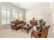 Elegant living room with plantation shutters, leather furniture, and a decorative area rug at 3410 E Inglewood Cir, Mesa, AZ 85213