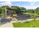 Aerial view features a shaded playground with slides, swings, and benches in a grassy area at 3410 E Inglewood Cir, Mesa, AZ 85213