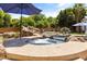 Backyard showcasing a luxurious pool with a spa, slide, rock features, and serene landscaping at 3410 E Inglewood Cir, Mesa, AZ 85213