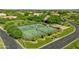 Aerial view of community tennis courts and pickleball court surrounded by manicured landscaping at 3410 E Inglewood Cir, Mesa, AZ 85213