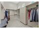 Spacious walk-in closet with built-in shelving, drawers, and hanging rods for ample storage at 3410 E Inglewood Cir, Mesa, AZ 85213