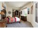 Cozy bedroom featuring southwest inspired decor and a plush carpet at 34221 N Boulders Pkwy, Scottsdale, AZ 85266