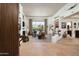 Spacious living room featuring large windows with pool view, neutral color palette, and fireplace at 34221 N Boulders Pkwy, Scottsdale, AZ 85266