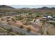 Desert home featuring a spacious yard with outbuildings, with desert landscaping and surrounding area views at 37414 N 17Th Ave, Phoenix, AZ 85086