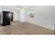 Bedroom with carpeting, a window, and a spacious closet at 37414 N 17Th Ave, Phoenix, AZ 85086