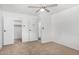 A cozy bedroom with neutral carpet, a ceiling fan, and closet space at 37414 N 17Th Ave, Phoenix, AZ 85086