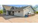 Exterior view of home showcasing large, paved driveway and unique stonework details and landscaping at 37414 N 17Th Ave, Phoenix, AZ 85086